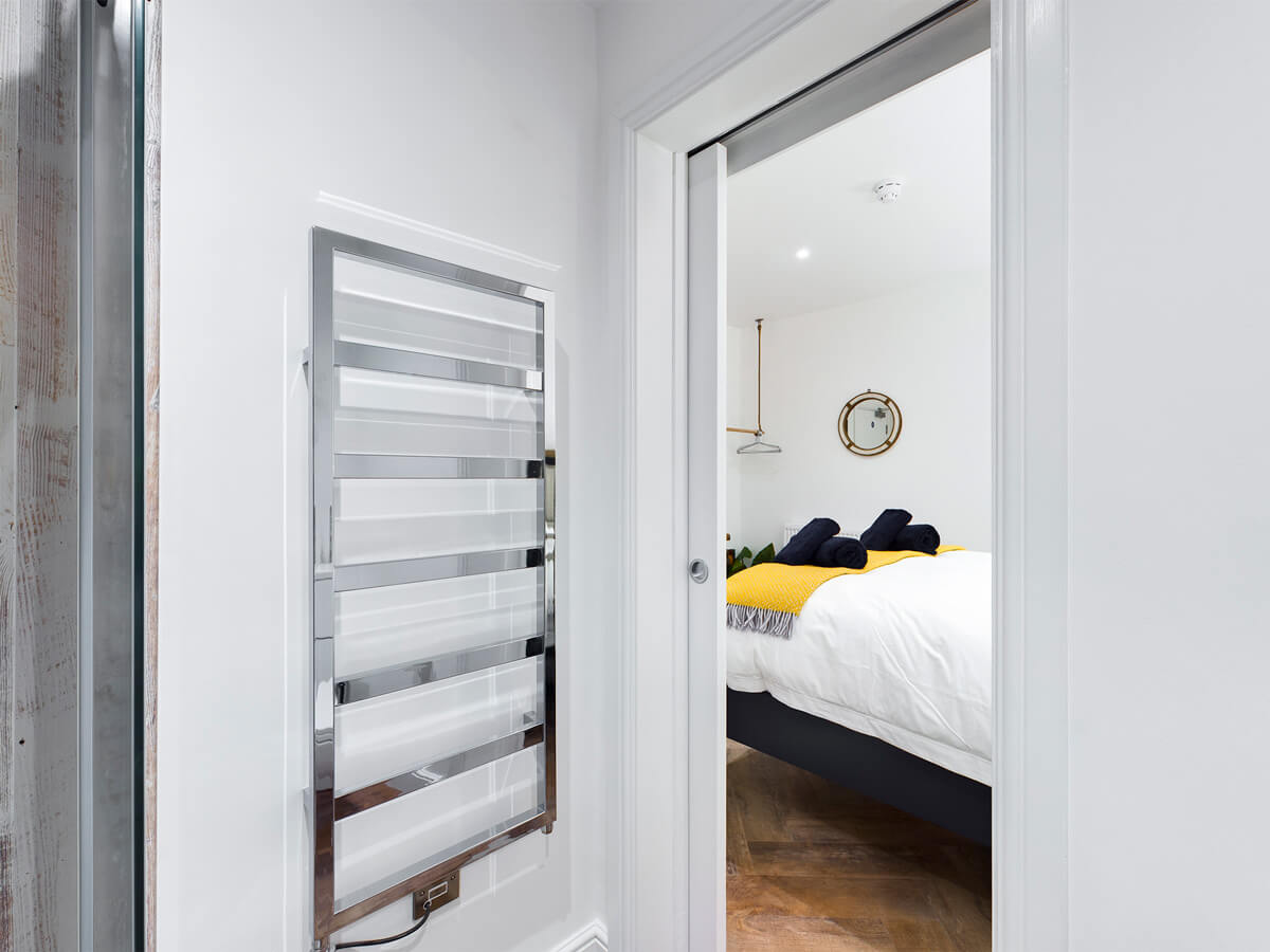 Room Two - showing towel rail and bedroom