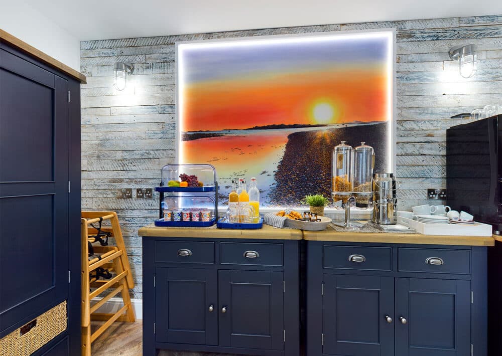 Dining room showing buffet area with bright artwork