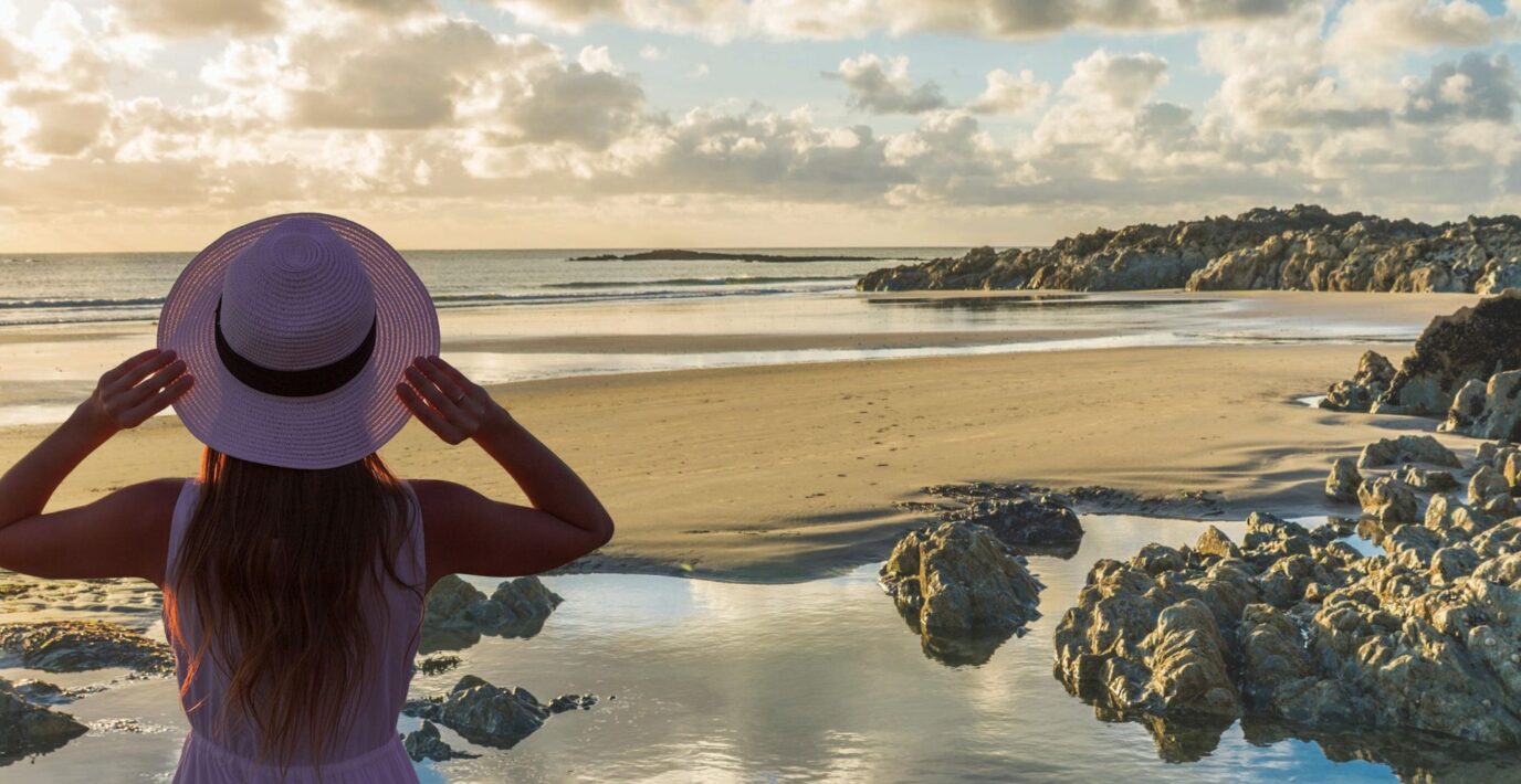 a female solo traveller on the beach in Rhosneir, North Wales